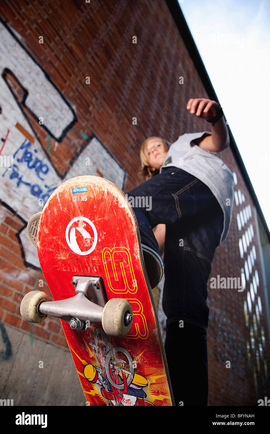low angle view of young boy skateboarding Stock Photo