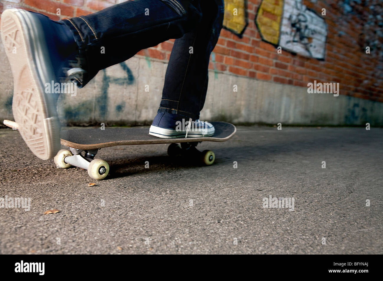detail of young boy skateboarding Stock Photo