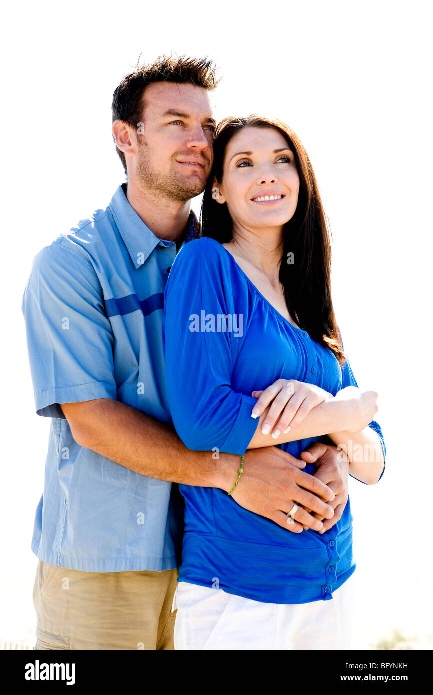 Mid adult couple embracing on the beach Stock Photo - Alamy