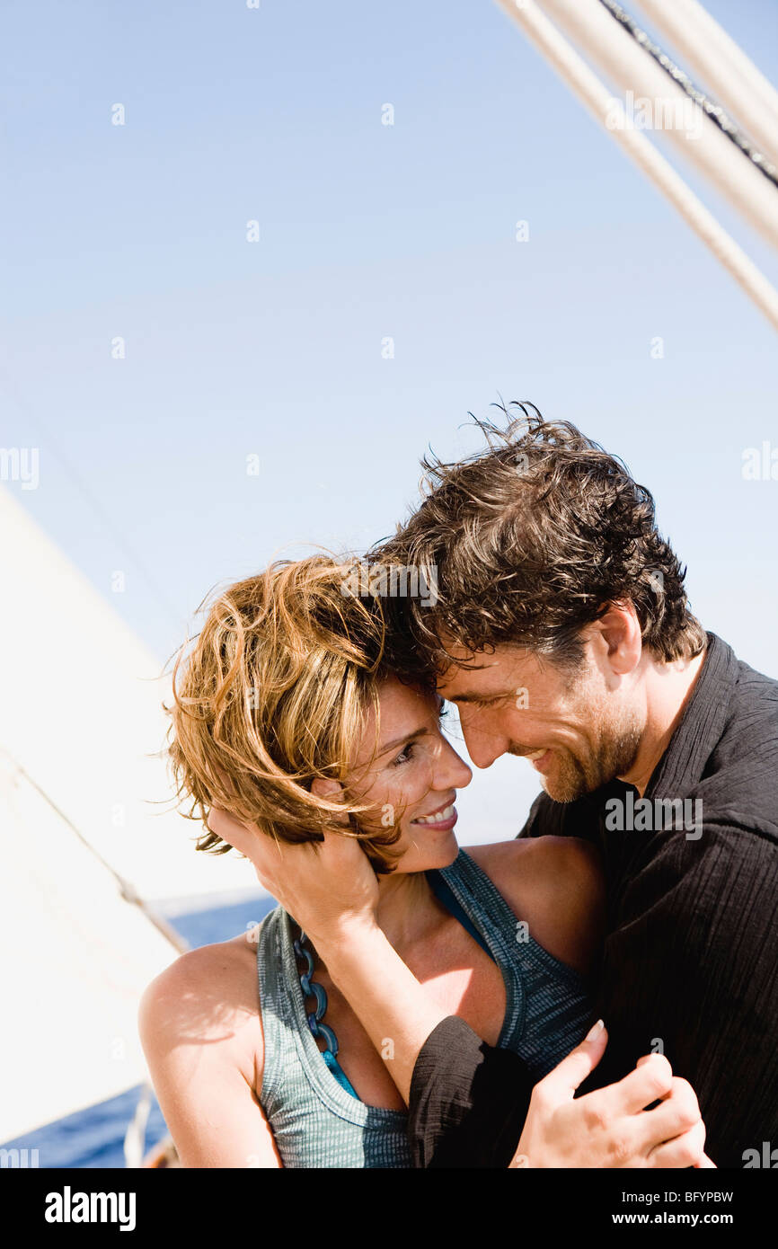 couple embracing each other on a boat Stock Photo