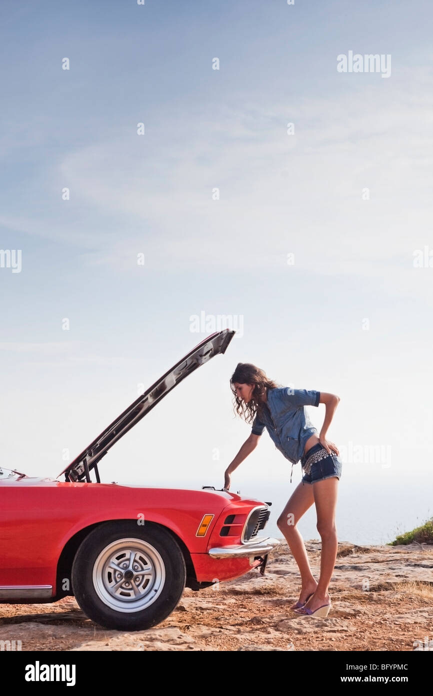 woman looking into opened car Stock Photo Alamy