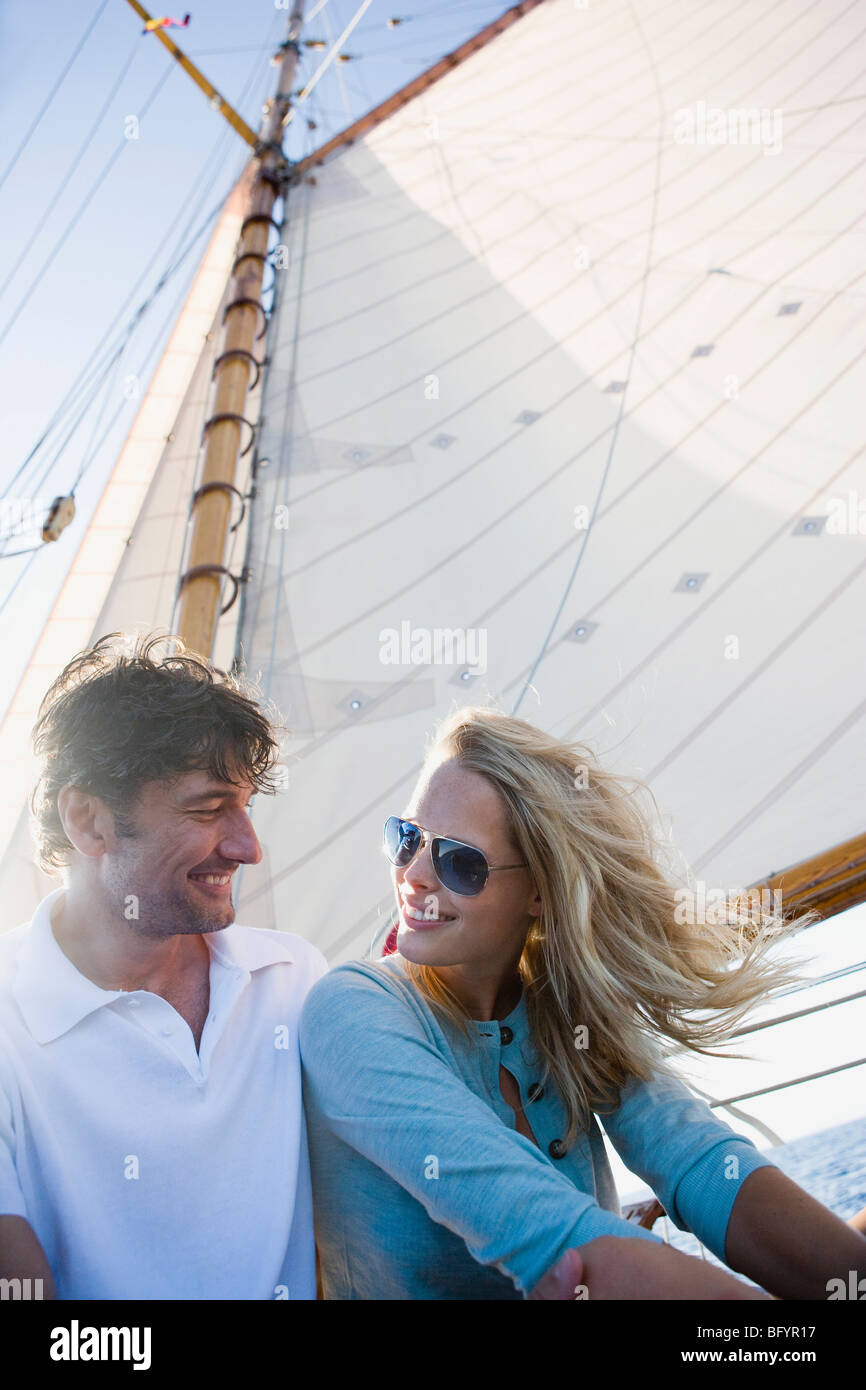 couple on a sailing boat smiling Stock Photo