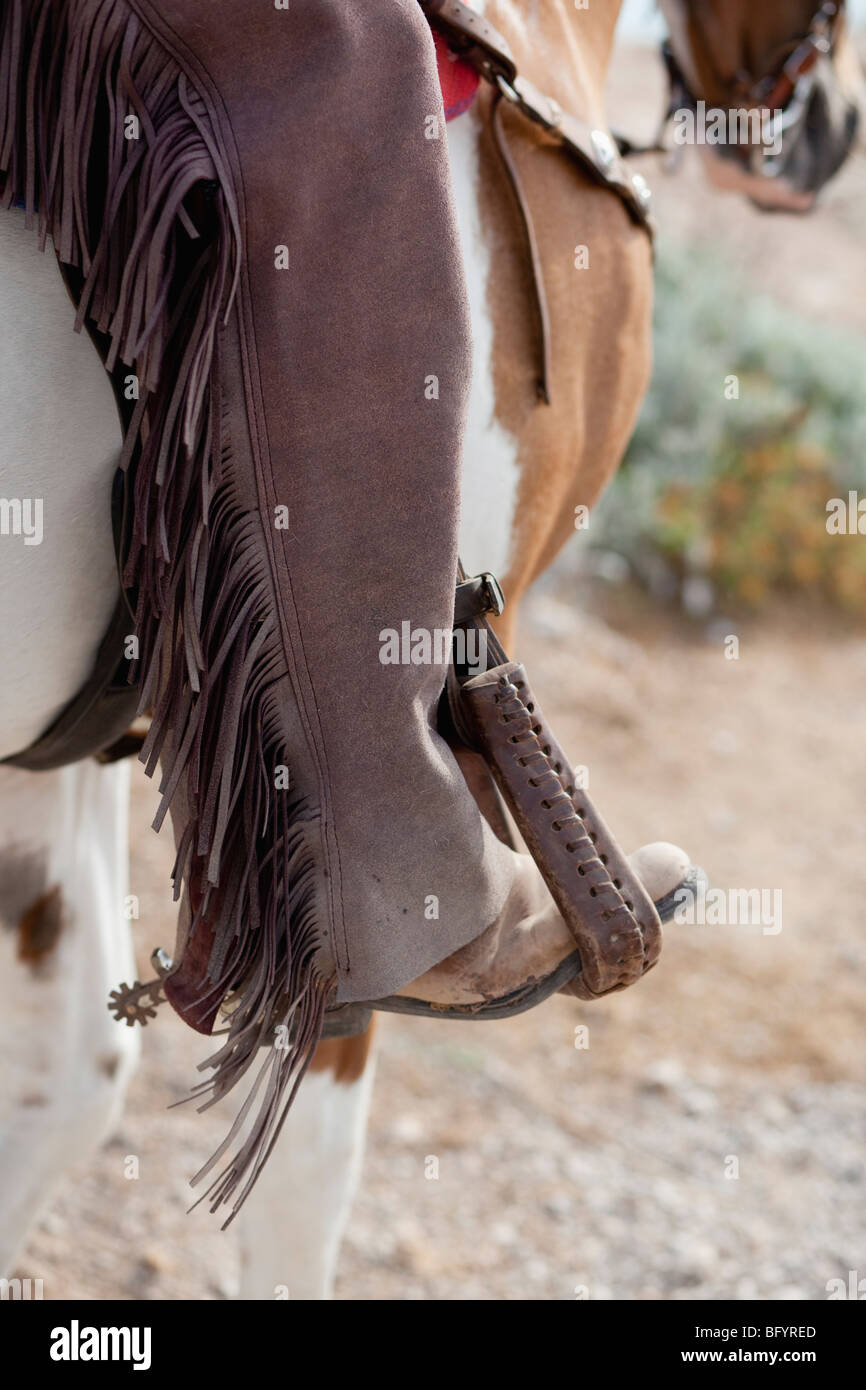 foot in stirrup Stock Photo