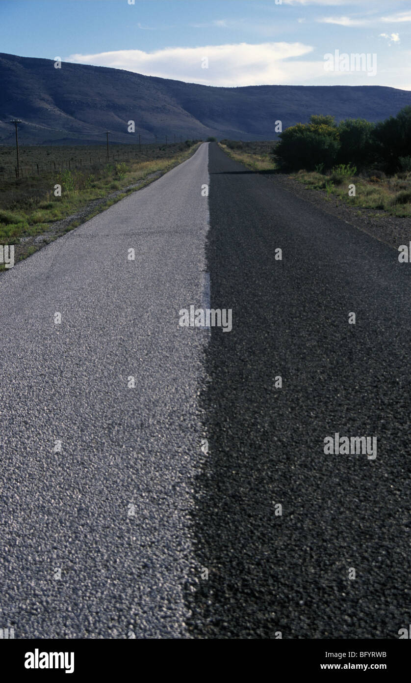 Country road partially resurfaced Stock Photo