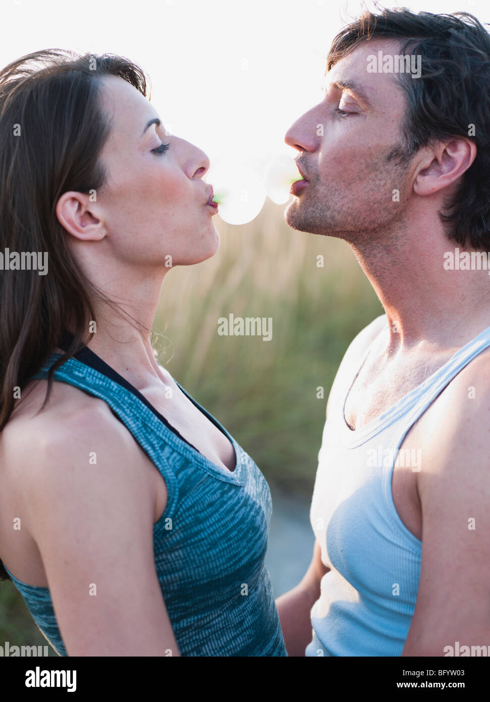 couple playing with bubble gum Stock Photo