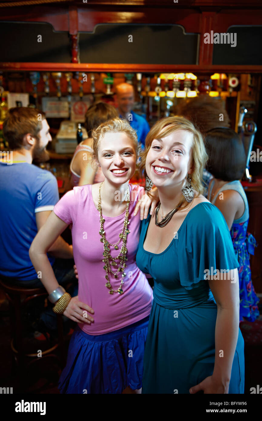 Young women posing in pub/bar Stock Photo - Alamy