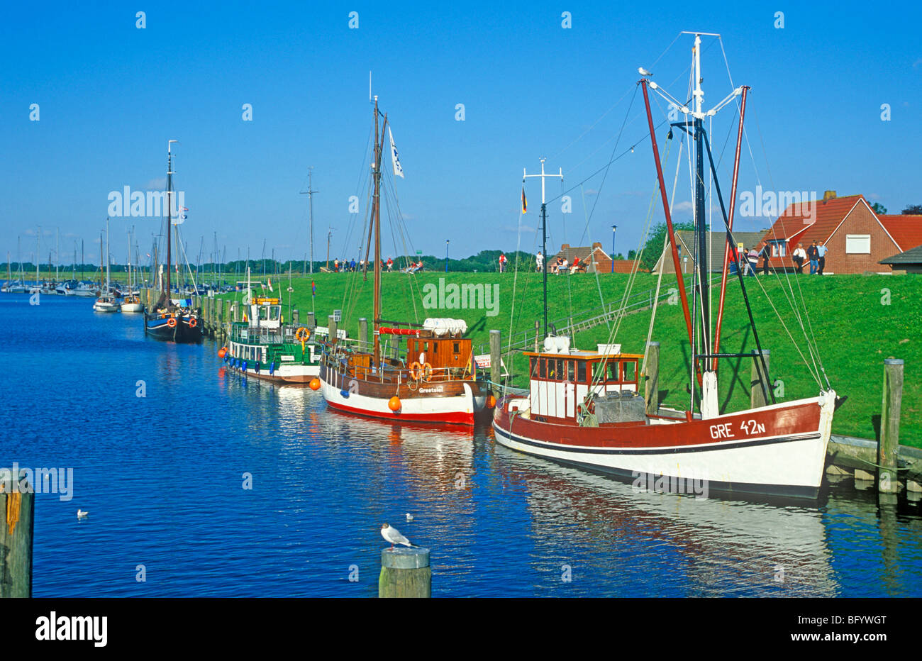 fishing trawlers at the harbour of Greetsiel, North Sea Coast, East Friesland, Lower Saxony, Germany Stock Photo