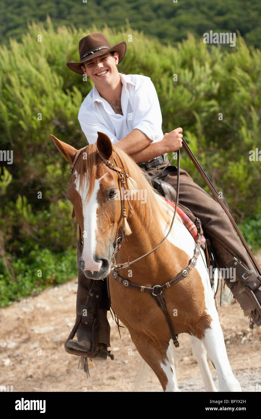 man riding horse smiling Stock Photo