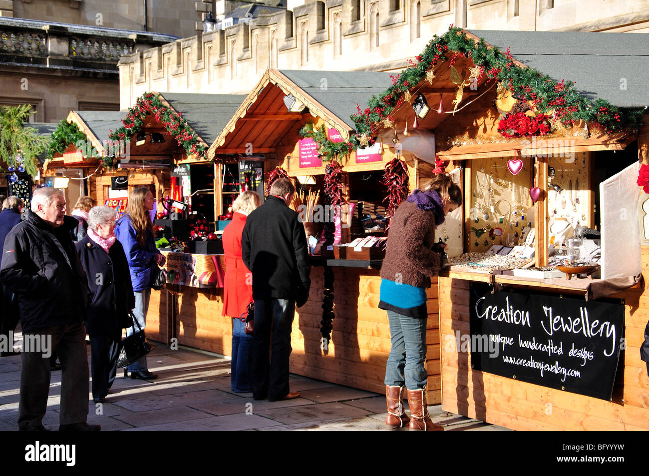 Market stalls and Bath Abbey, Christmas Market, Bath, Somerset, England
