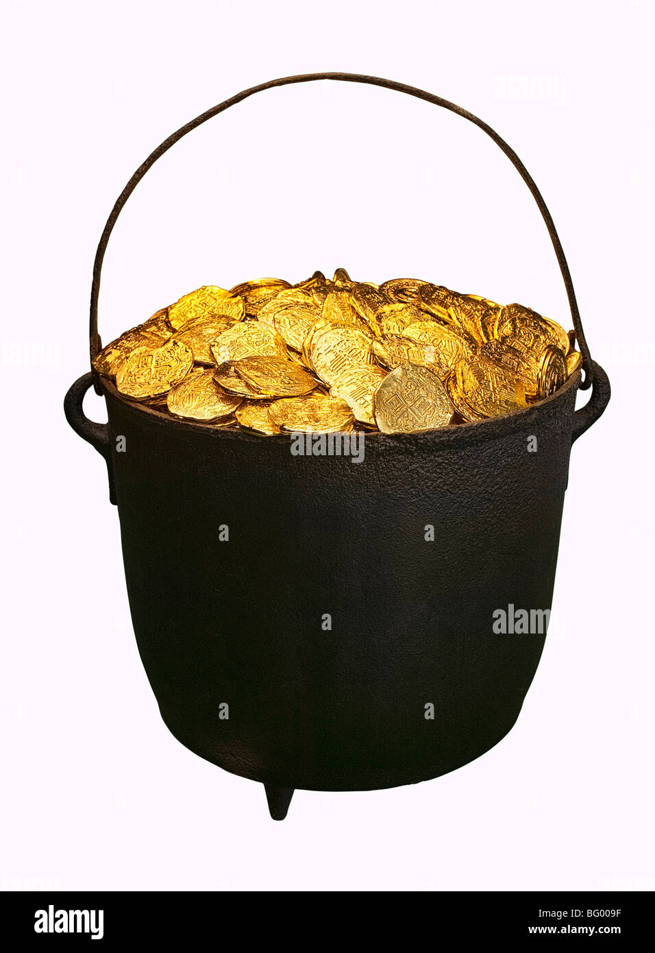 Caldron full of gold coins against a white background Stock Photo