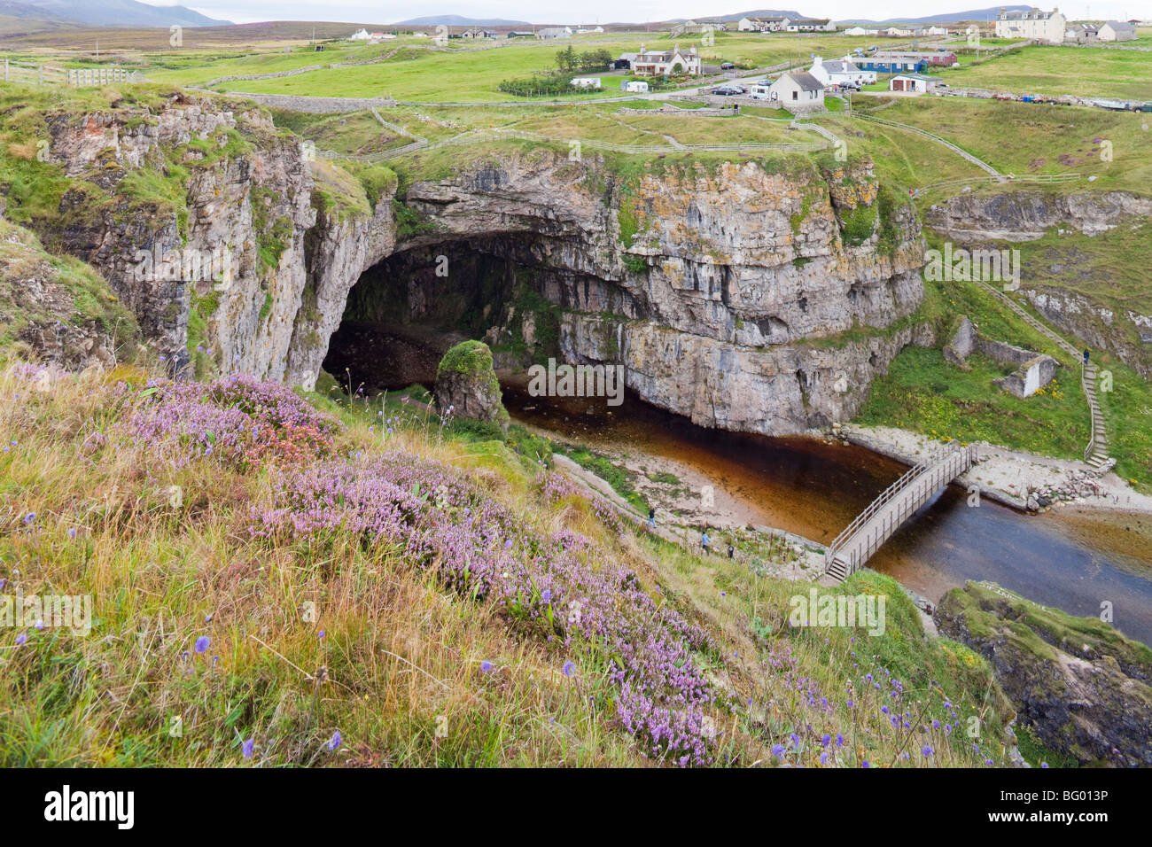 The river Allt Smoo emerging from the entrance to Smoo Cave at Durness, Highland, Scotland Stock Photo