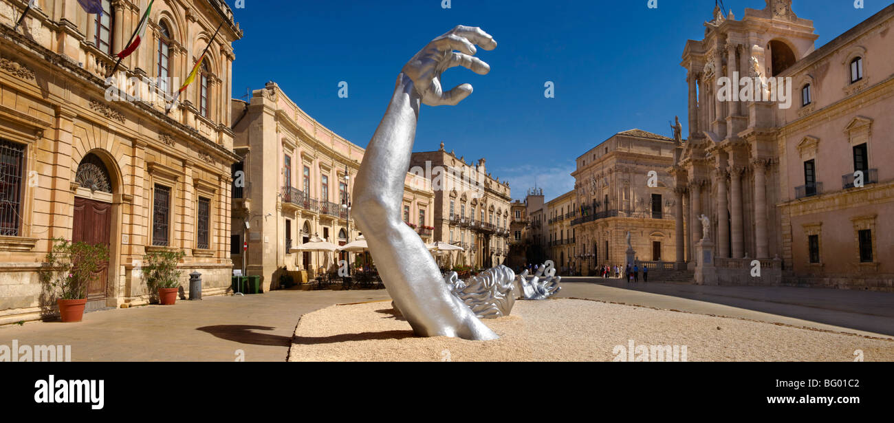 'The Awakening' a 70 ft sculpture aluminuim sculpture by Seward Johnson - Duomo square, Siracusa, Sicily. Stock Photo