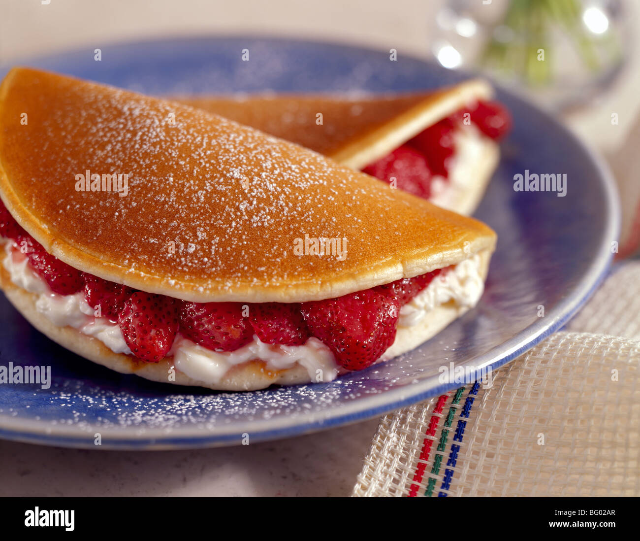 Strawberry stuffed pancakes with cream cheese Stock Photo
