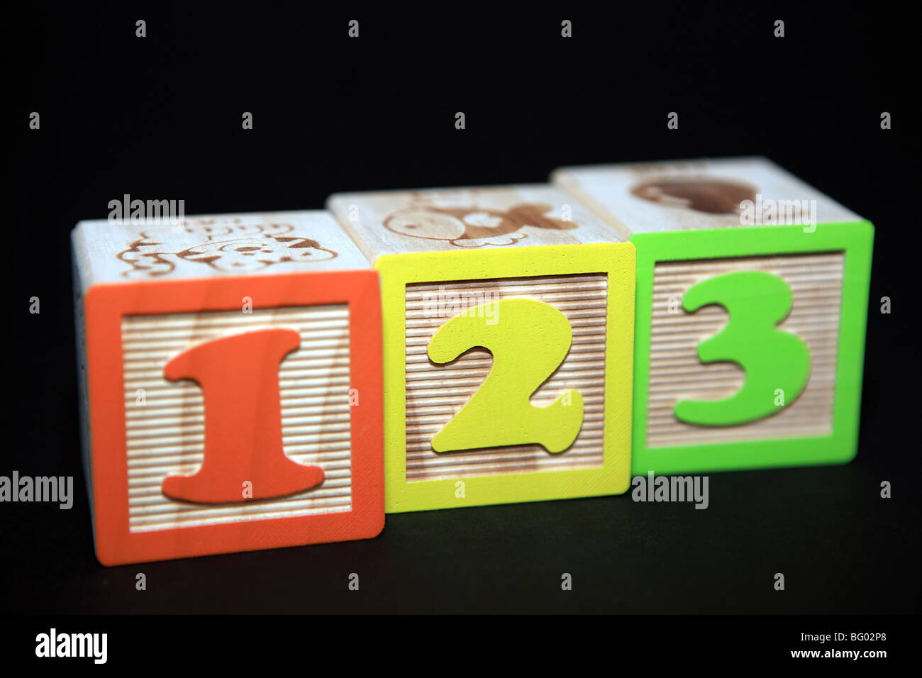 1 2 3 children's building blocks against a black background Stock Photo