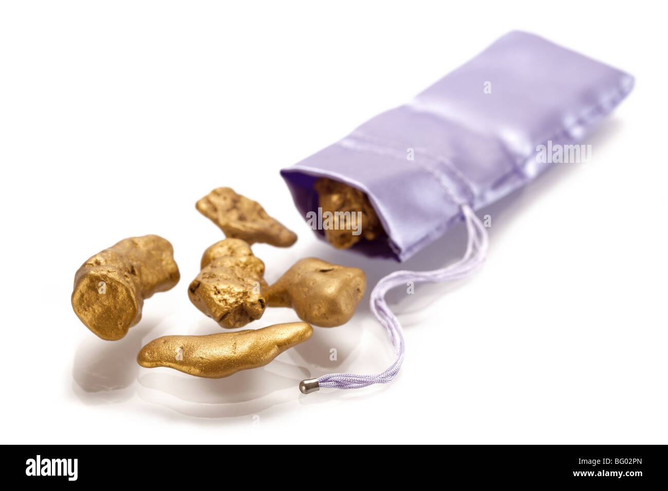 Nuggets of gold on a white background Stock Photo - Alamy