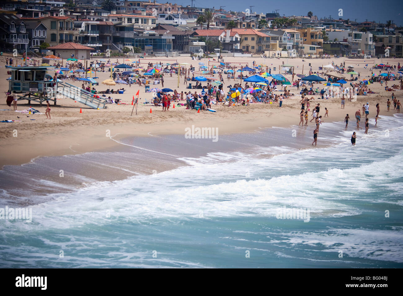 crowd of people during a hot day in Manhattan Beach, California, United States of America Stock Photo