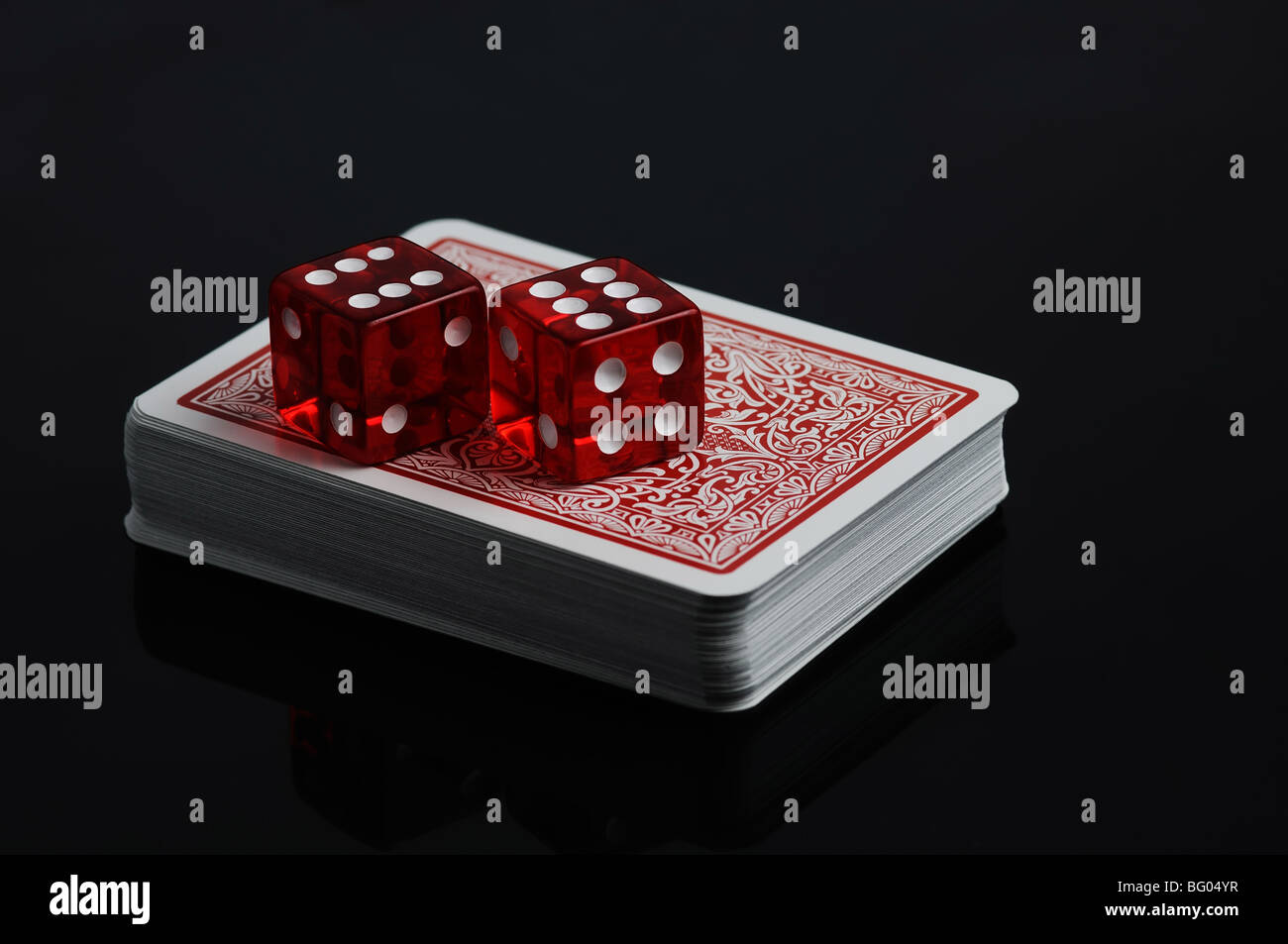 Cards and red dices on a black background Stock Photo