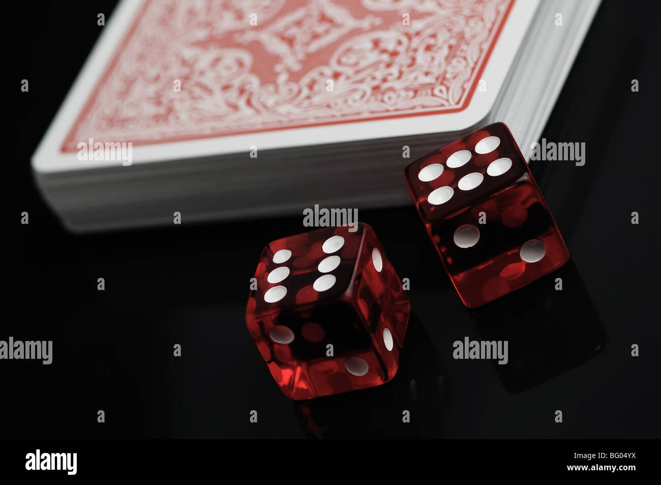 Cards and red dices on a black background Stock Photo