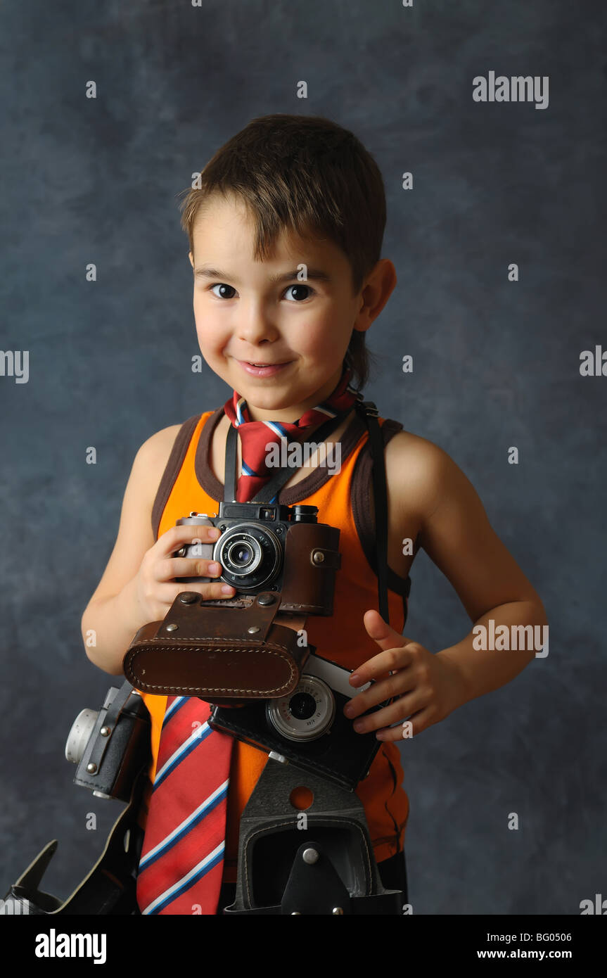 Young boy with cameras Stock Photo