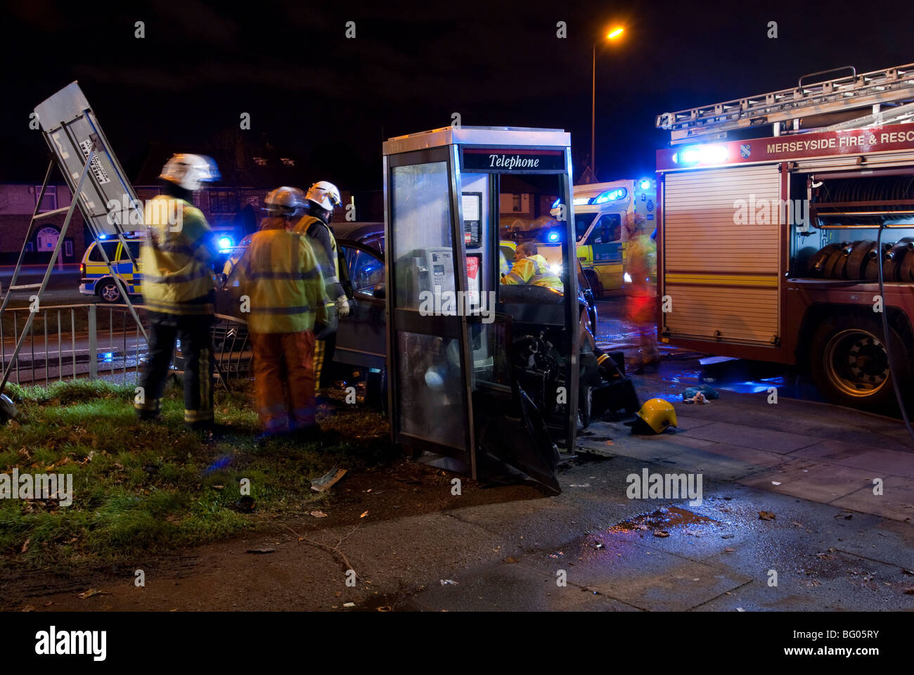 RTA Road traffic collision at night with Fire & Rescue Service extricating trapped driver Stock Photo
