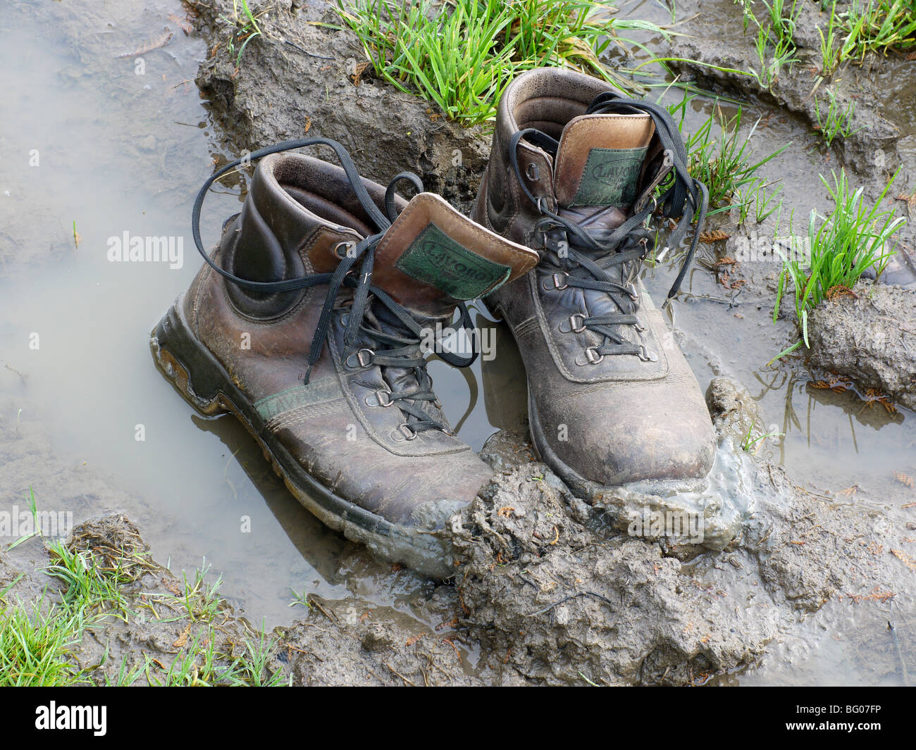 Boots being stuck in the mud. Stock Photo