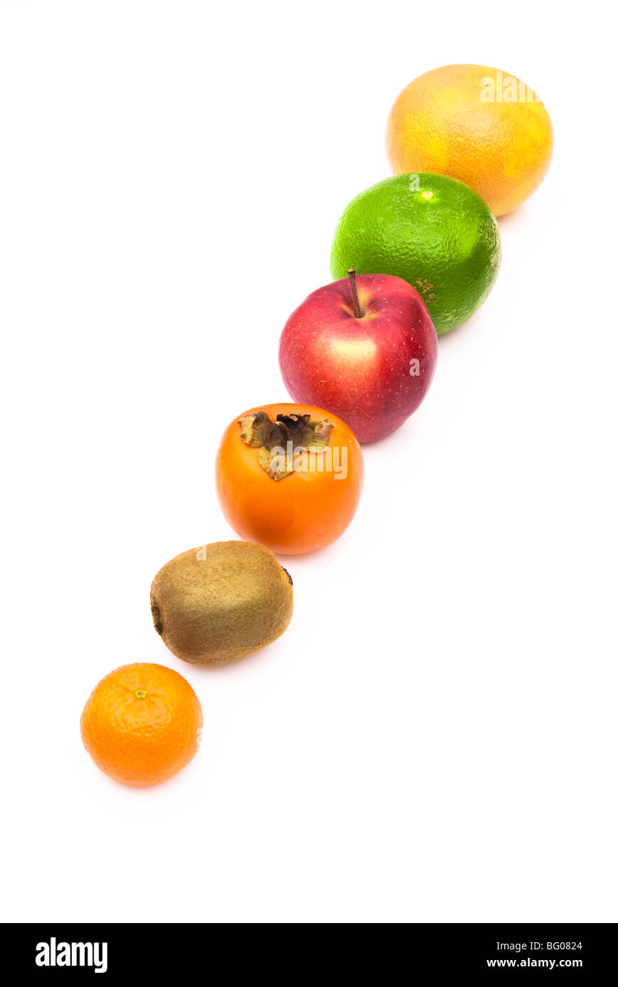 row of fresh fruits orange apple kiwi kaki grapefruit isolated Stock Photo