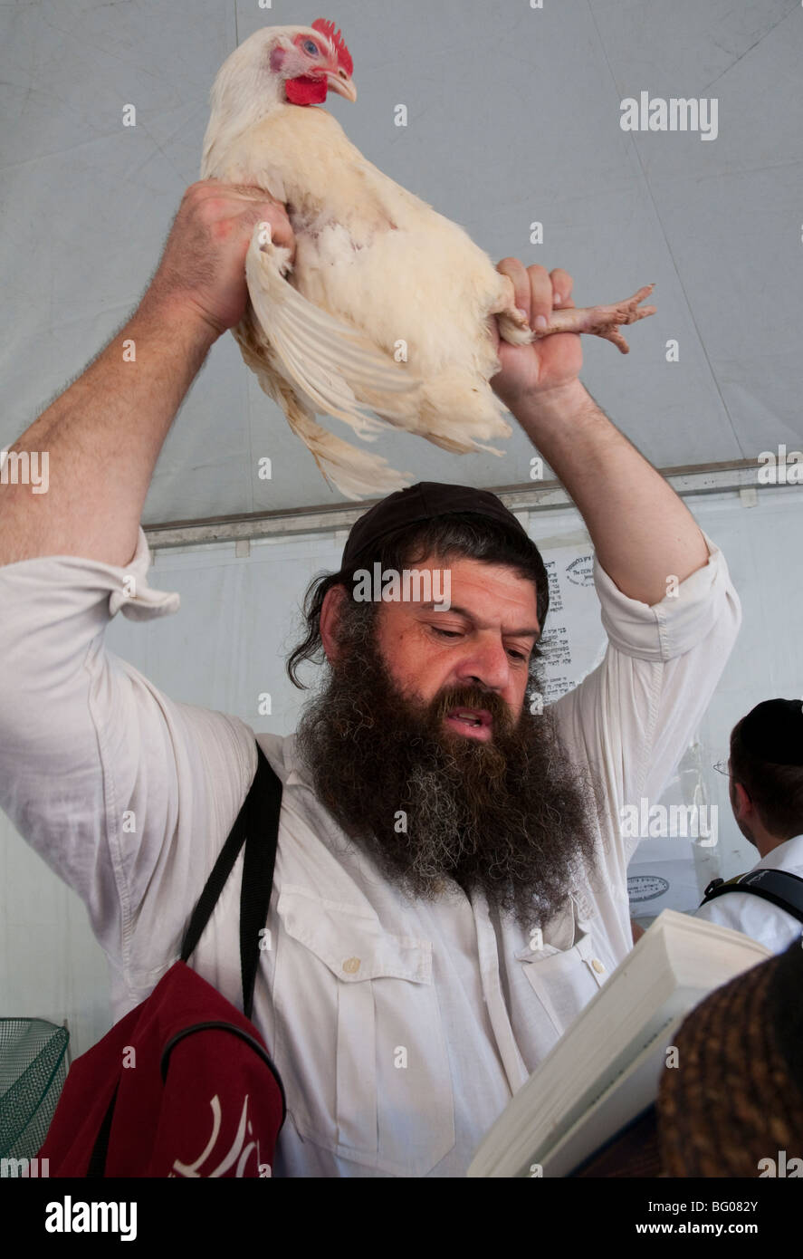Jews performing the Kaparot ritual on the eve of Yom Kippur Stock Photo