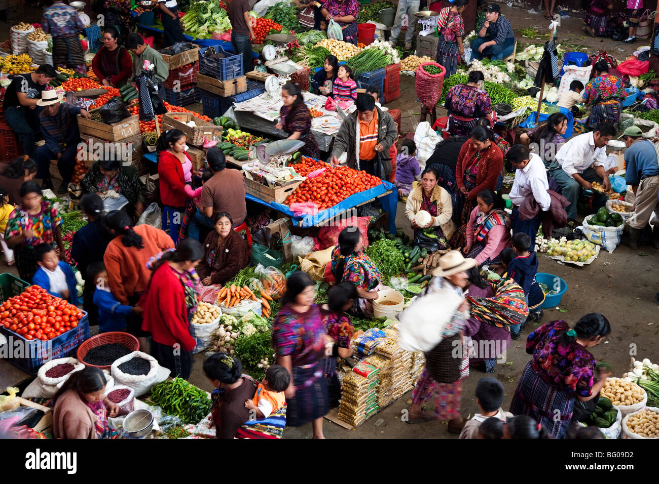 Shoppers and vendors at busy outdoor market, elevated view in Chichicastenango Guatemala. Stock Photo