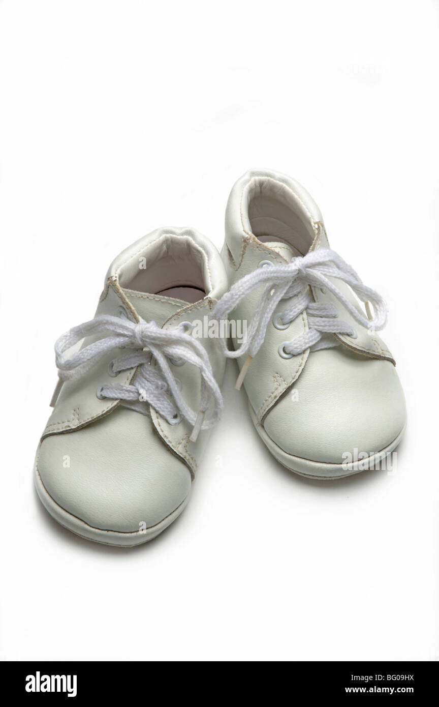 White baby shoes on white Stock Photo - Alamy