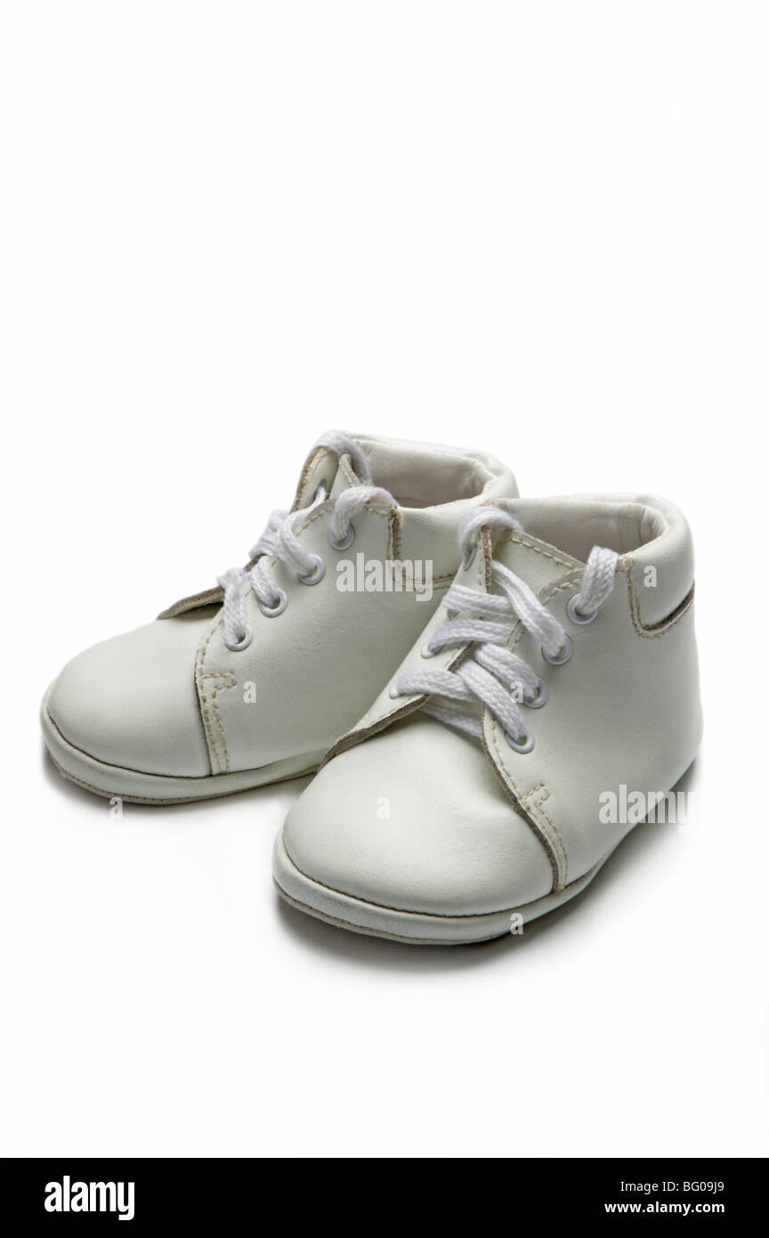 White baby shoes on white Stock Photo - Alamy