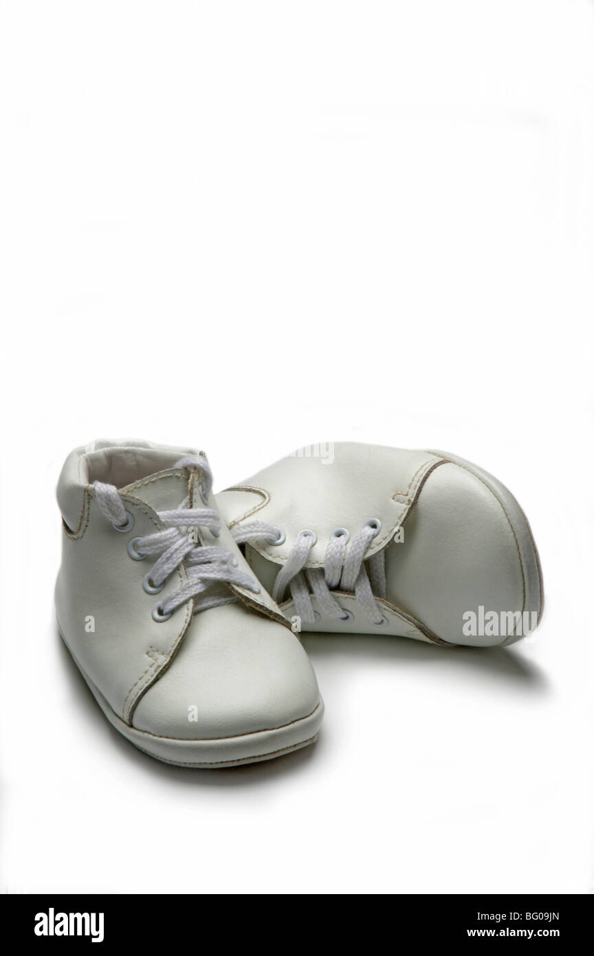 White baby shoes on white Stock Photo - Alamy