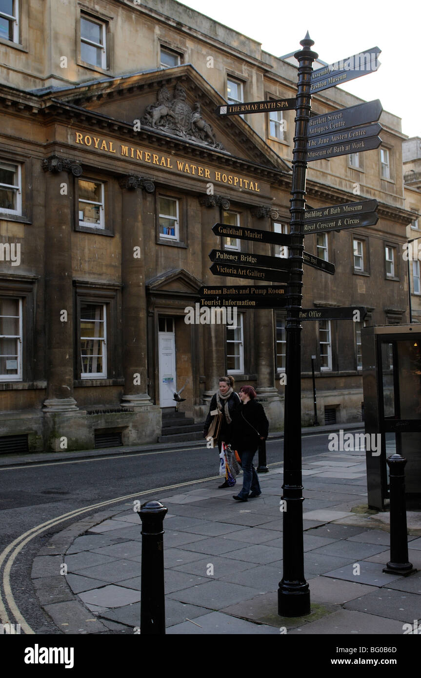 The historic Royal Mineral Water Hospital and tourist signpost in Bath