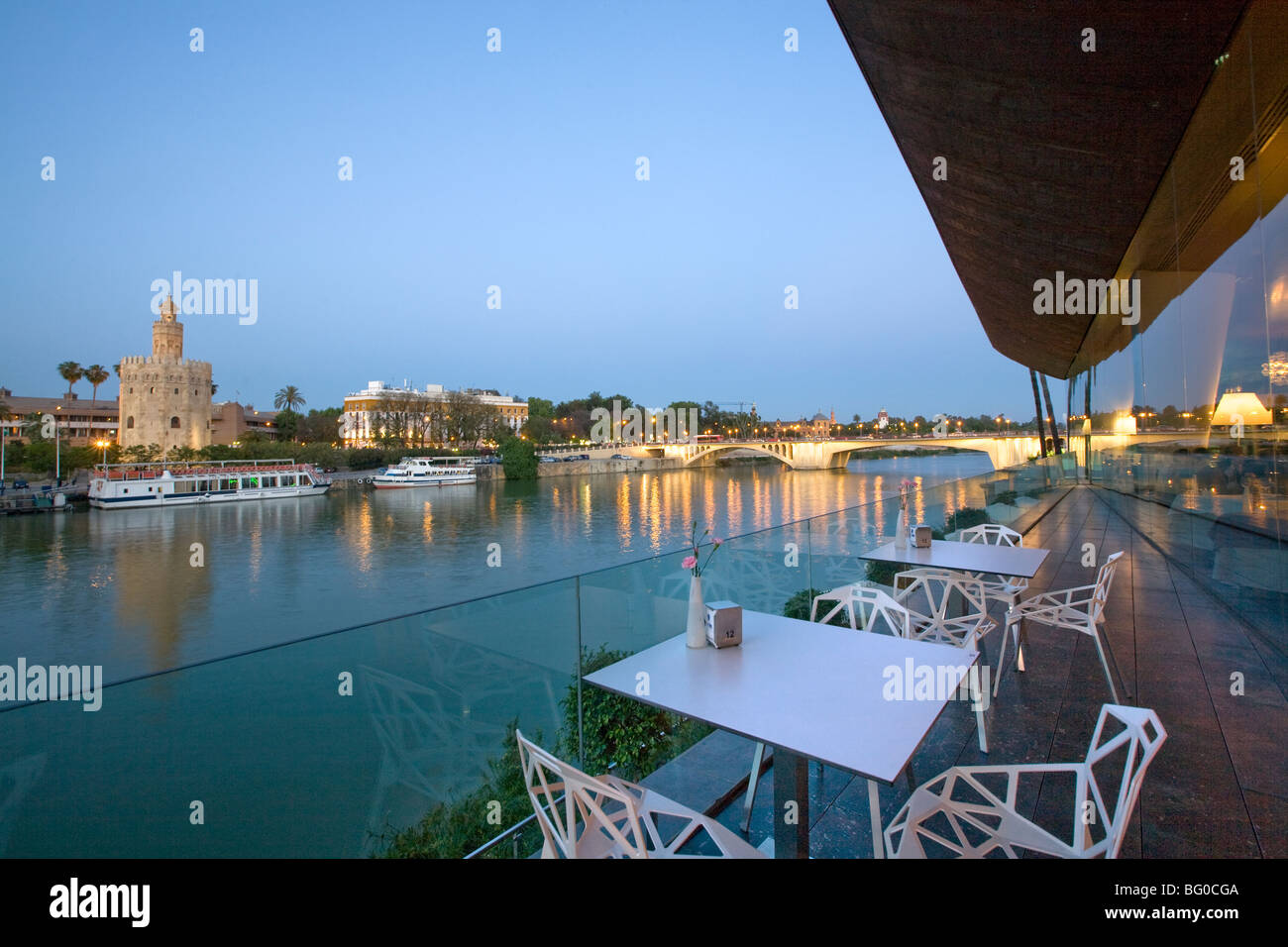 Empty chairs and tables at a tourist resort, Torre Del Oro, Seville, Spain Stock Photo