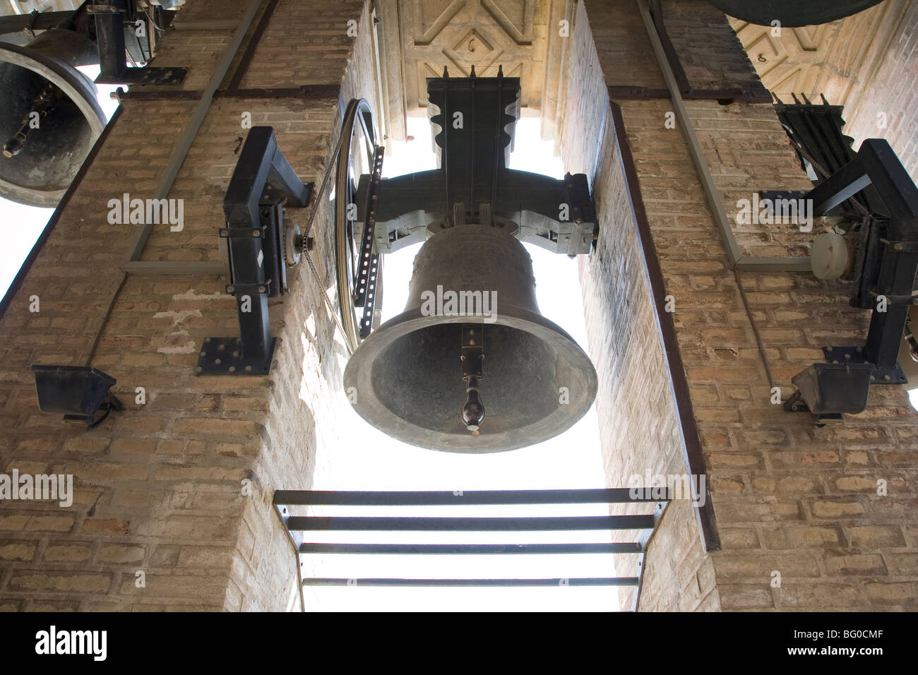 Low angle view of a bell in the bell tower, Giralda de Sevilla, Seville Cathedral, Seville, Spain Stock Photo