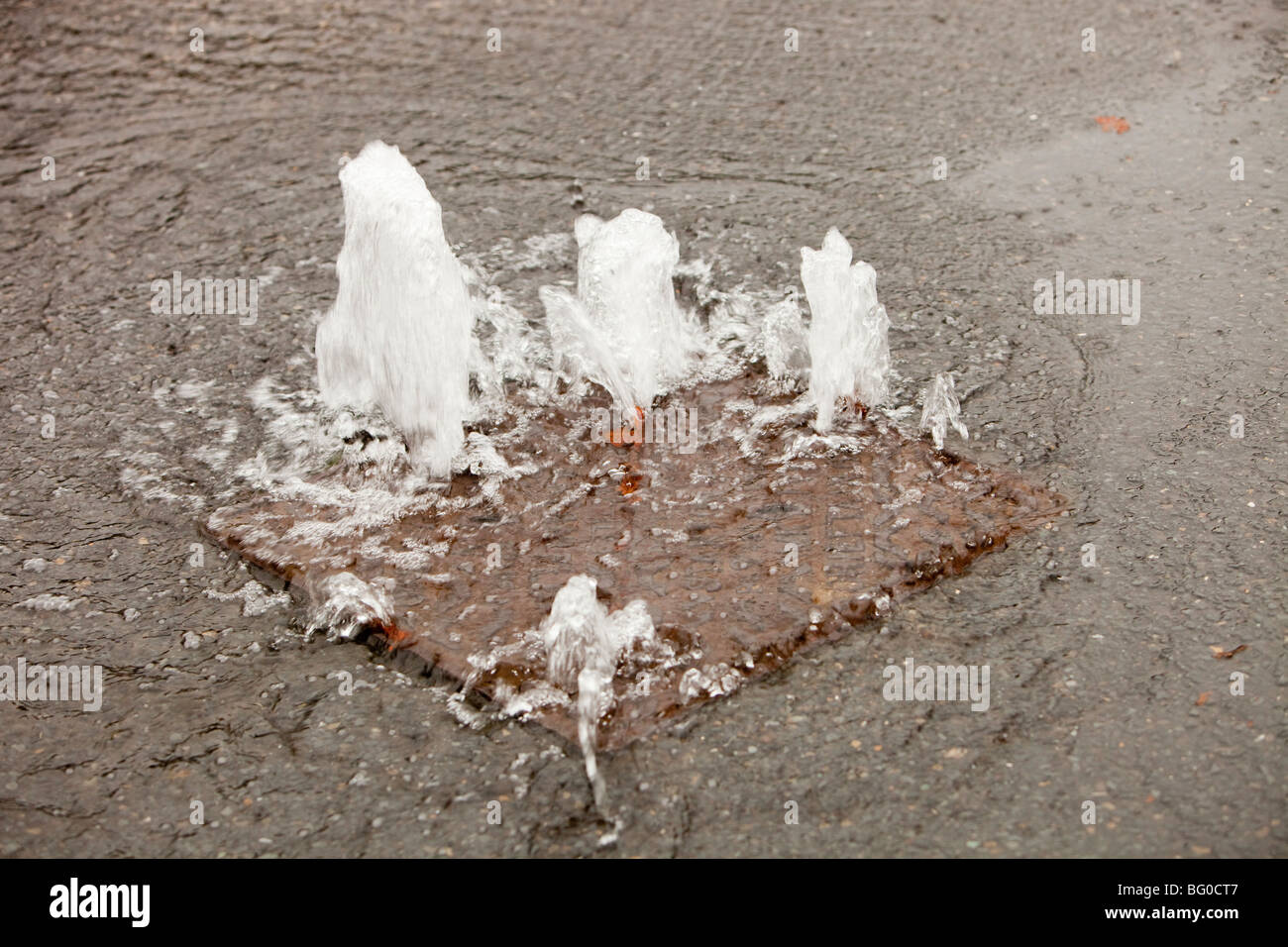 A flooded sewer drain in Ambleside during the devastating November 2009 ...