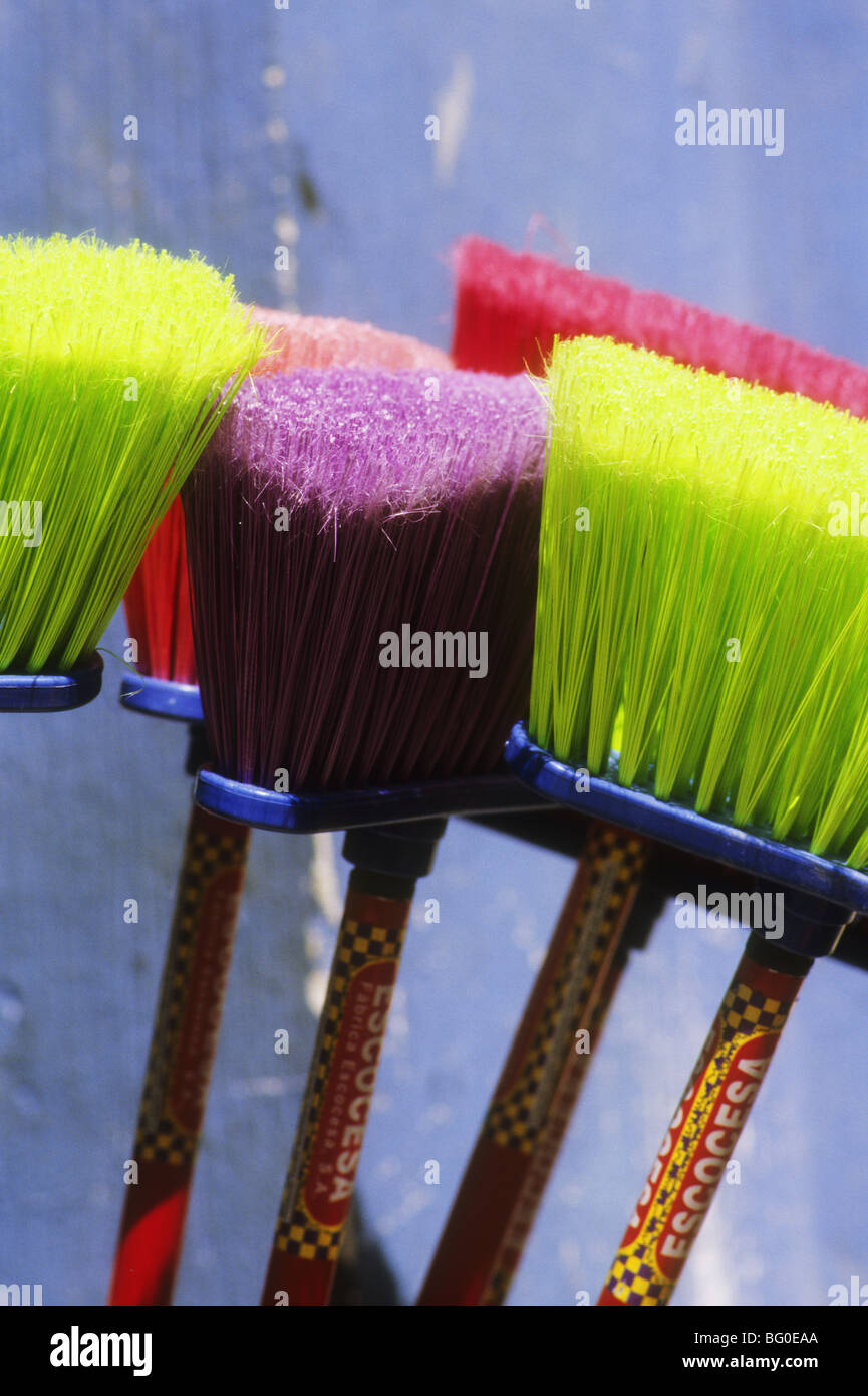 Colorful brooms for sale at a small shop in Joyabaj, Guatemala Stock