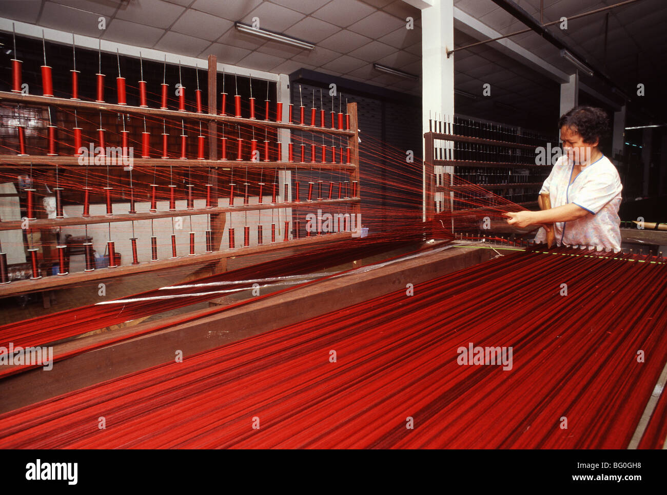 Stretching Silk at Jim Thomson Factory in Korat, Thailand, Southeast Asia, Asia Stock Photo