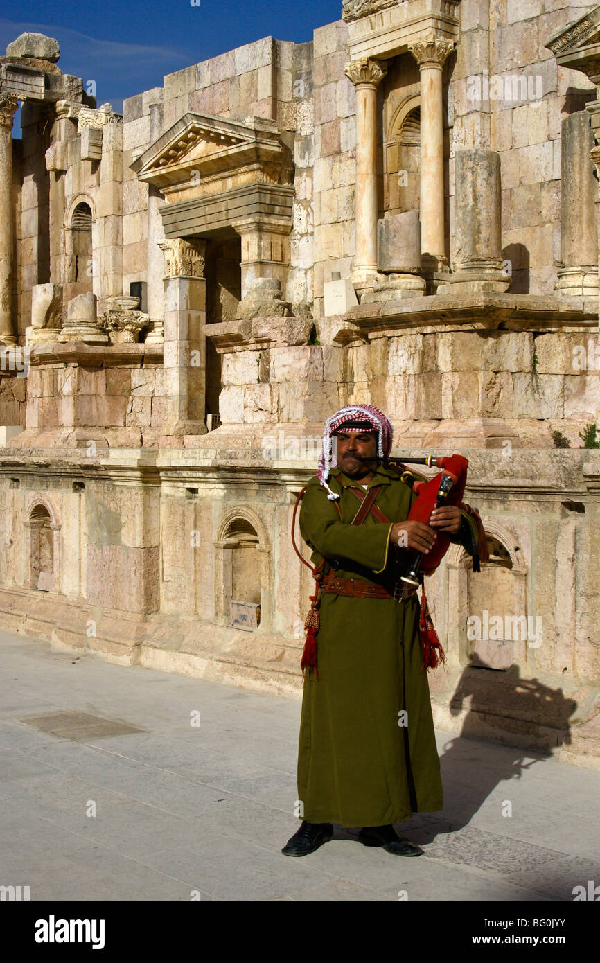Jordanian soldier playing bagpipe in theater, Jerash, Jordan Stock Photo
