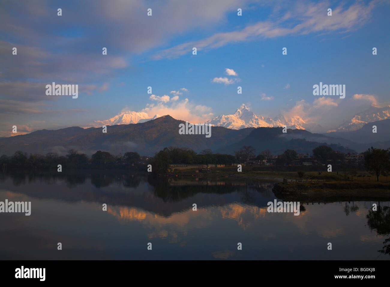 Annapurna range reflecting in Fewa (Phewa) Lake at dawn, Pokhara, Nepal, Asia Stock Photo