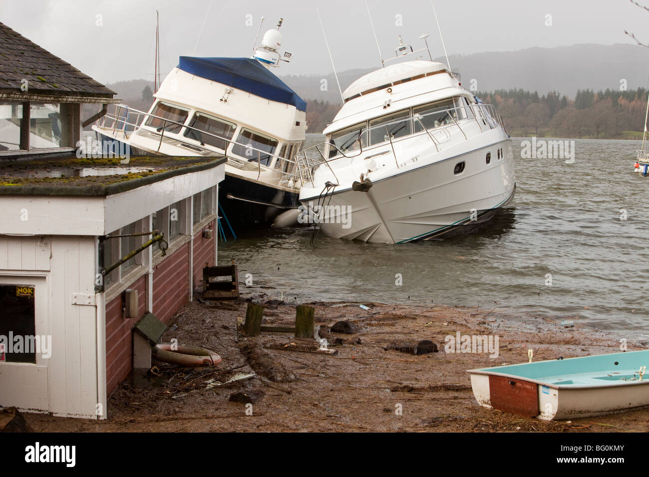 Boats damaged on Windermere in Ambleside during the devastating November 2009 floods, Cumbria, UK. Stock Photo
