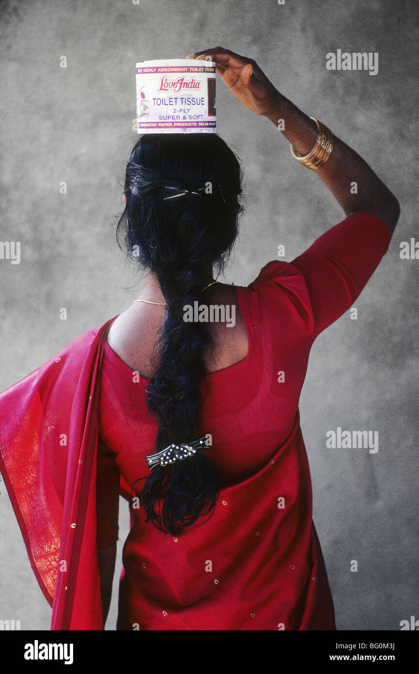 Indian woman in red sari holding Love India Toilet paper on her head Stock  Photo - Alamy