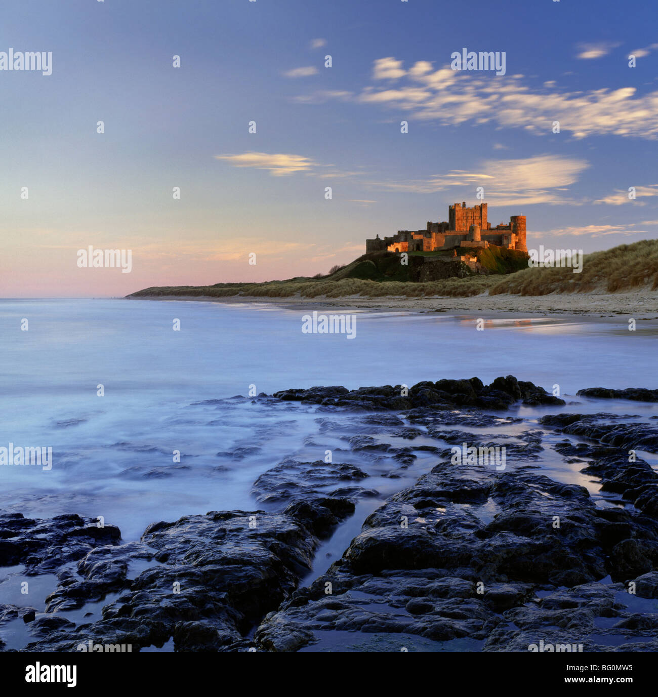 Bamburgh Castle bathed in warm evening light, Bamburgh, Northumberland