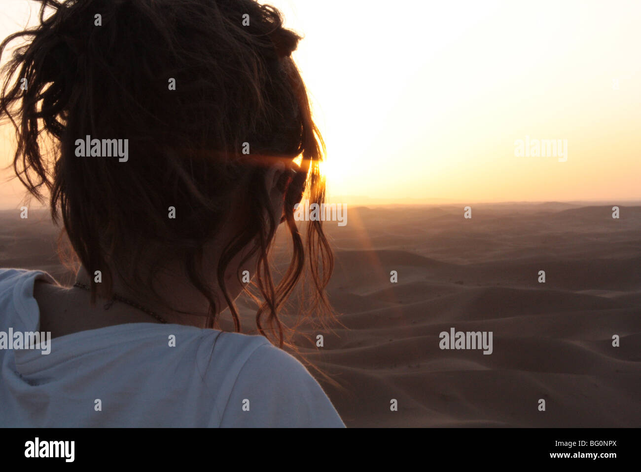 Woman watching sunset in desert hi-res stock photography and images - Alamy
