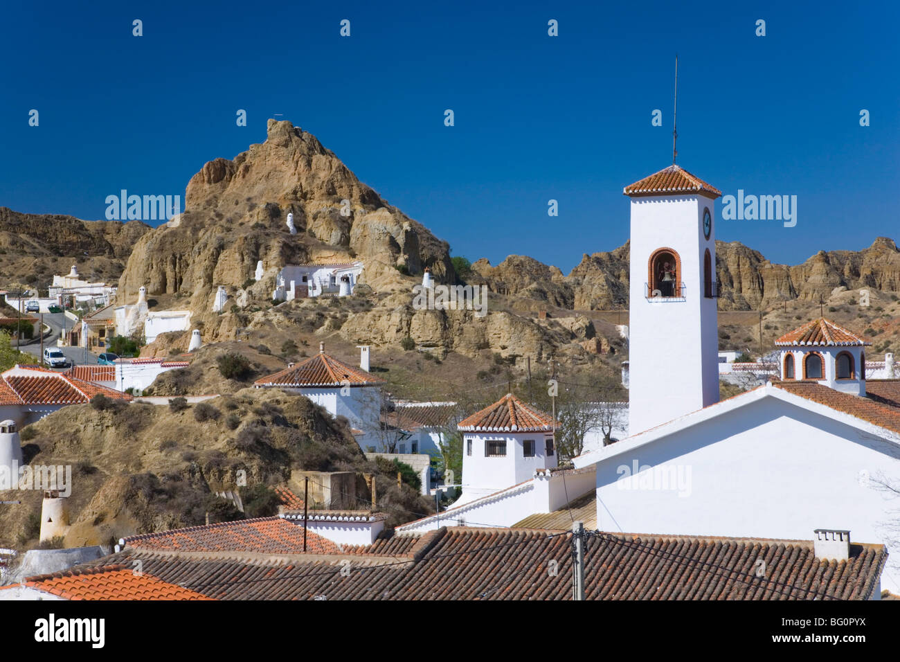 View across rooftops to cave houses in the troglodyte district, Guadix, Granada, Andalucia (Andalusia), Spain, Europe Stock Photo