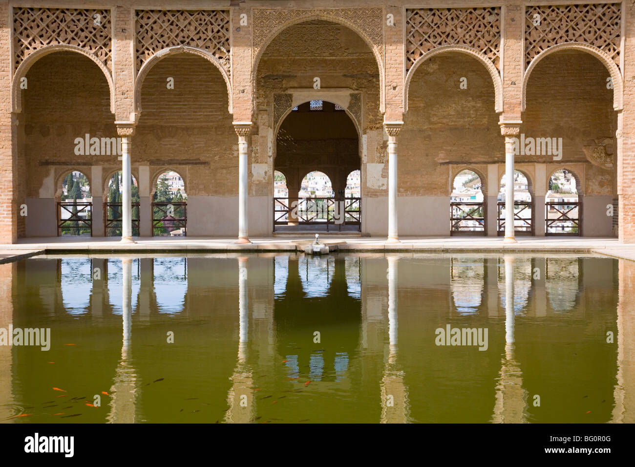 Portico of Torre de las Damas reflected in tranquil pool, Jardines del Partal, Alhambra, Granada, Andalucia (Andalusia), Spain Stock Photo