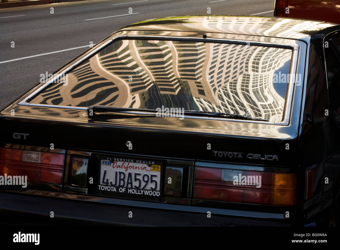 downtown buildings on Figueroa reflecting in a window of a car, Los Angeles, California, United States of America Stock Photo