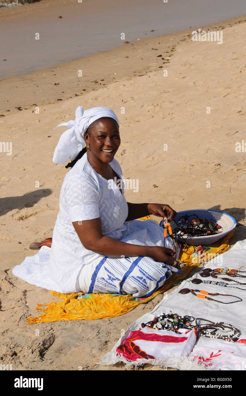 Hawker on beach at Saly, Senegal, West Africa, Africa Stock Photo