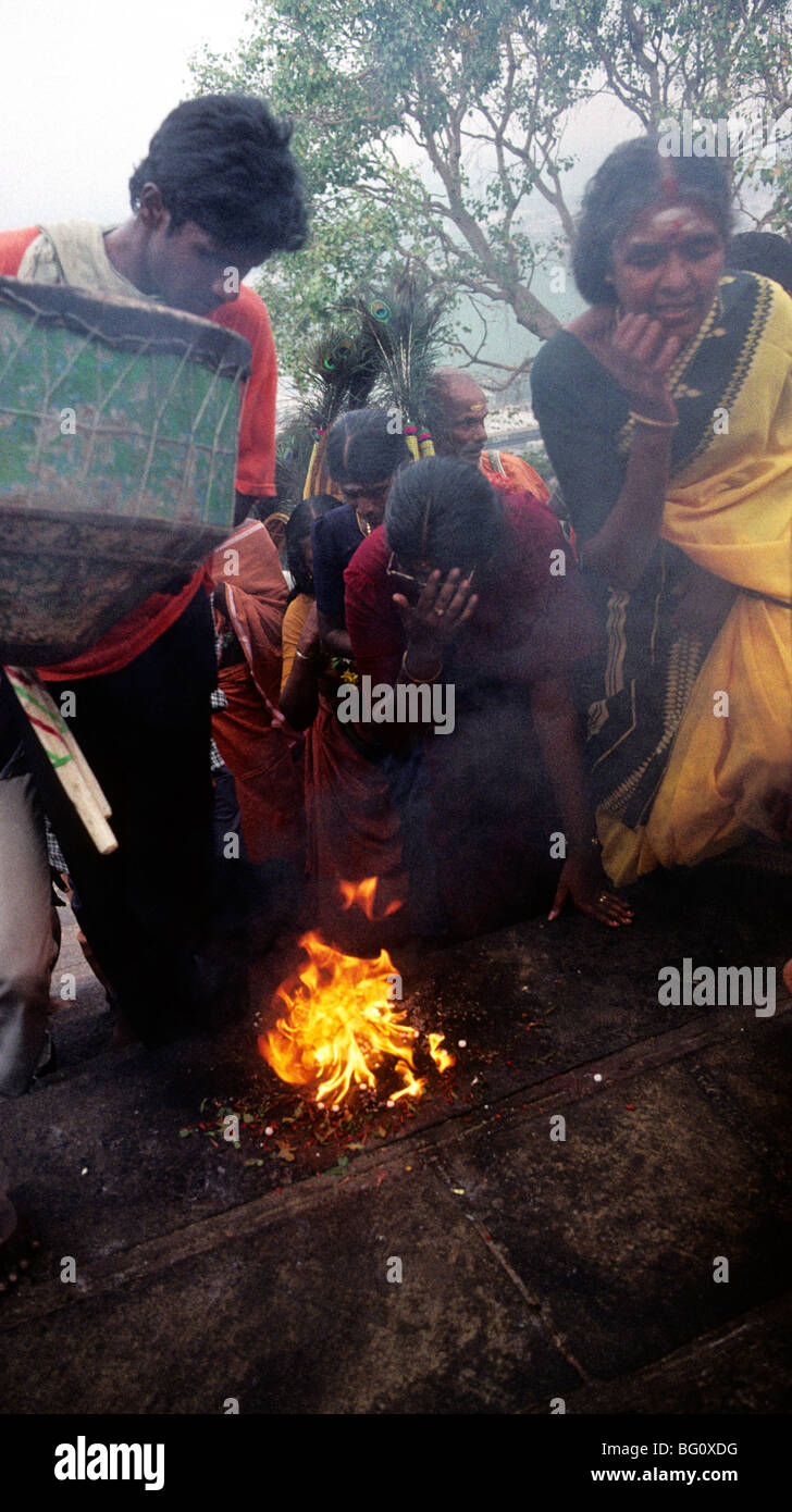 Pigrims touch fire climbing the steps to the Palani Murugan Temple, Palani Tamil Nadu during the annual Hindu Thaipusam festival Stock Photo