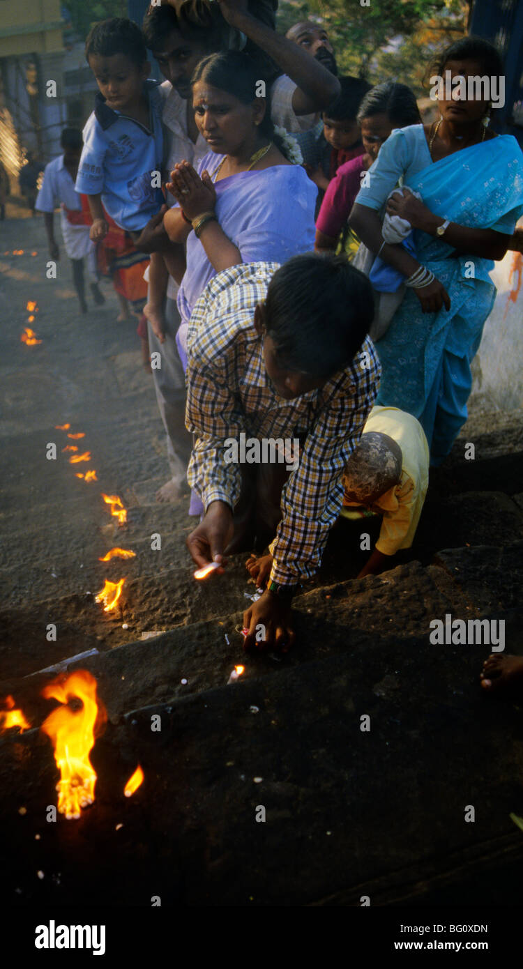 Pigrims touch fire climbing the steps to the Palani Murugan Temple, Palani Tamil Nadu during the annual Hindu Thaipusam festival Stock Photo