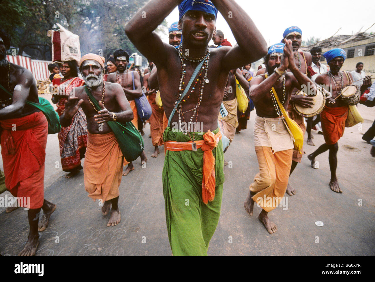 A group of devotees and pilgrims dance sing through the streets of Palani Tamil Nadu during the annual Hindu Thaipusam festival Stock Photo
